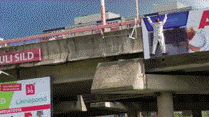 Help him! He will fall! Eyecatching advert on the highway