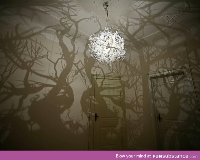 A chandelier that transforms rooms to a haunted forest