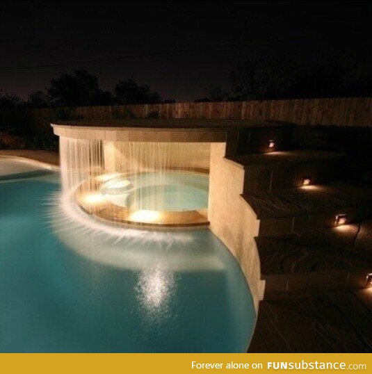 Hot tub under a waterfall