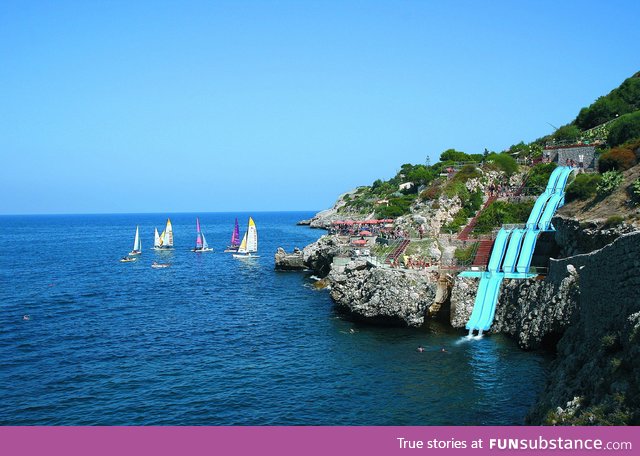 This giant water slide in Italy drops you into the ocean!