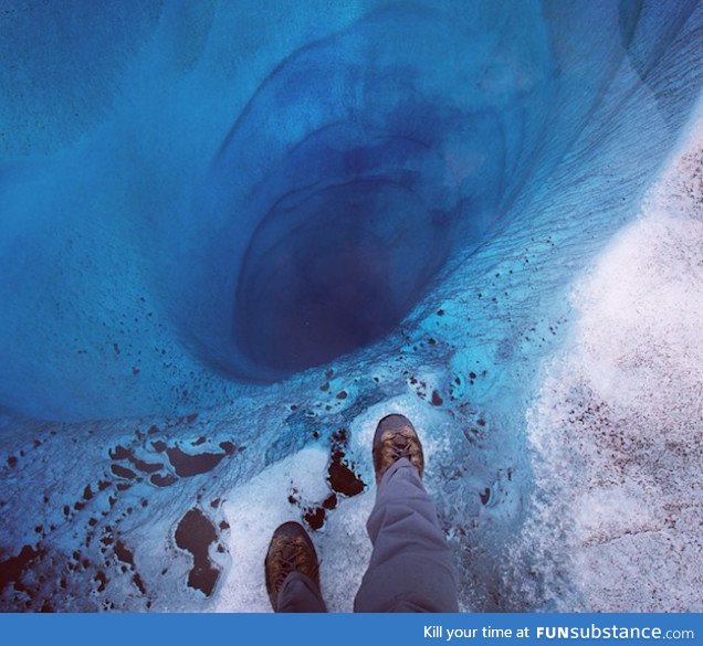 1000 ft hole found at Lower Ruth Glacier in Alaska covered only by a sheet of clear ice