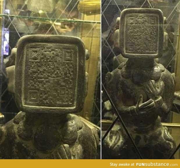 Ancient Mayan statue has QR code on its face