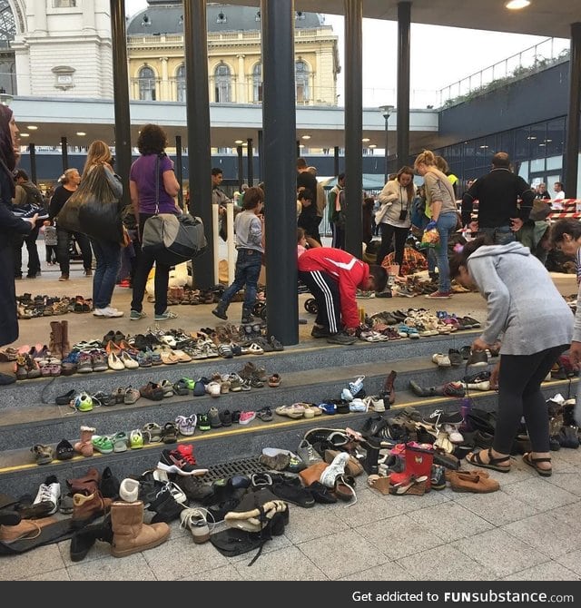 Hungarians bring their shoes to the Budapest train station for arriving migrants
