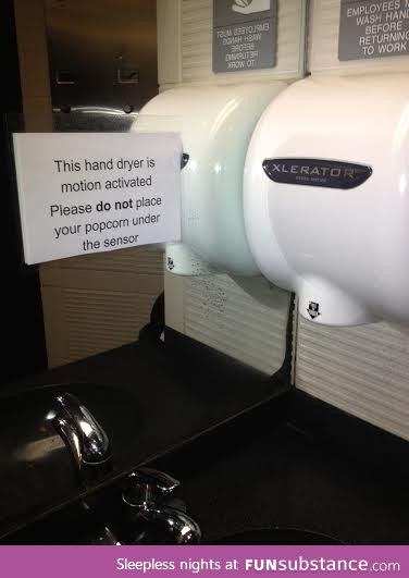 This Sign in the Bathroom of a Movie Theater Creates a Few Questions