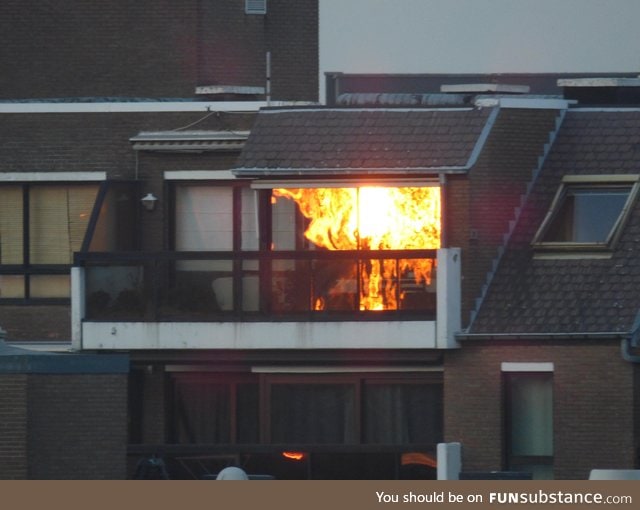 Sunset reflection makes neighbors house look like it's on fire