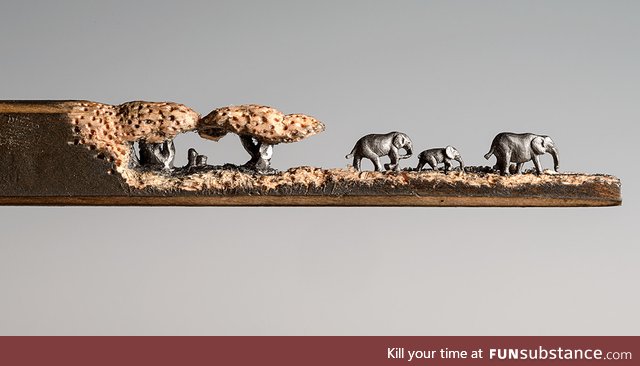 "Elephant Walk" Artist carves scene onto a Pencil