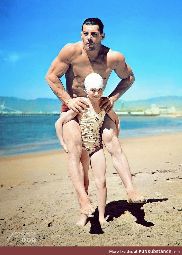 Patricia O'Keefe, who weighs only sixty-four pounds, holds two-hundred-pound Wayne Long