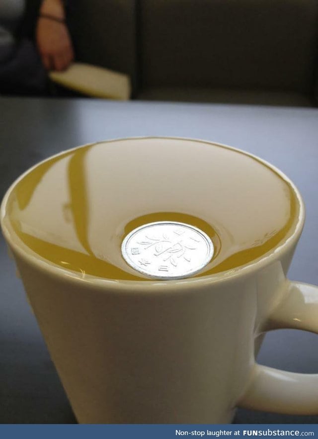 A Japanese Yen1 coin is so light it won't even break surface tension on water