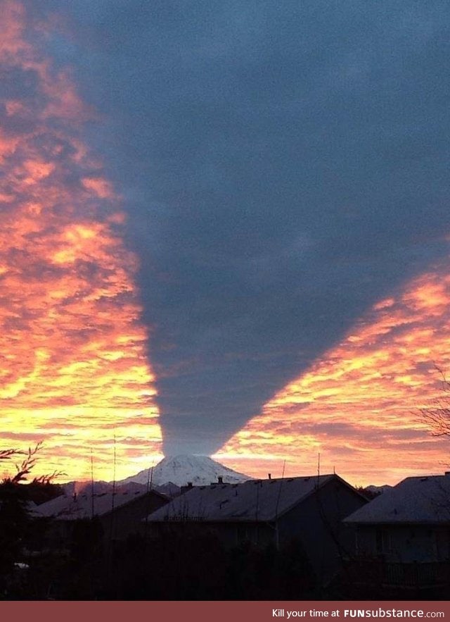 Mt. Rainier casting a shadow during a sunset