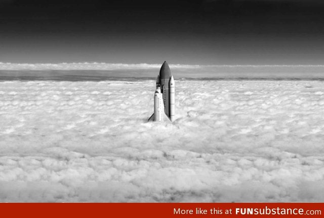 Shuttle breaks clouds