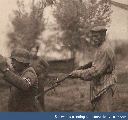 A librated jewish holocaust survivor turning the tables, circa 1945