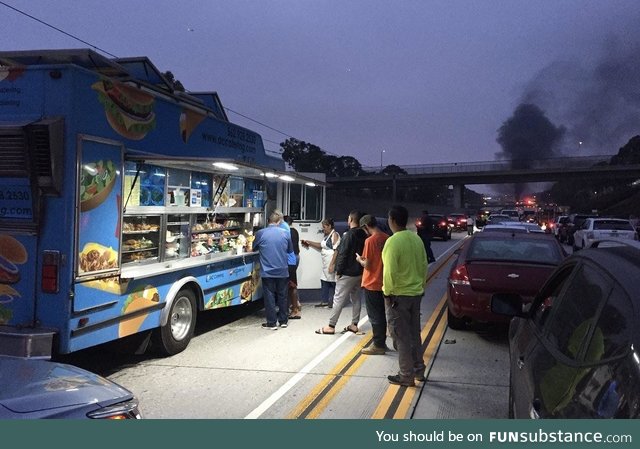 Taco truck start doing business during accident related traffic jam