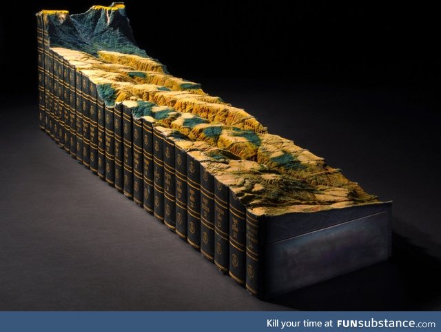 Mountainscape carved from old encyclopedias