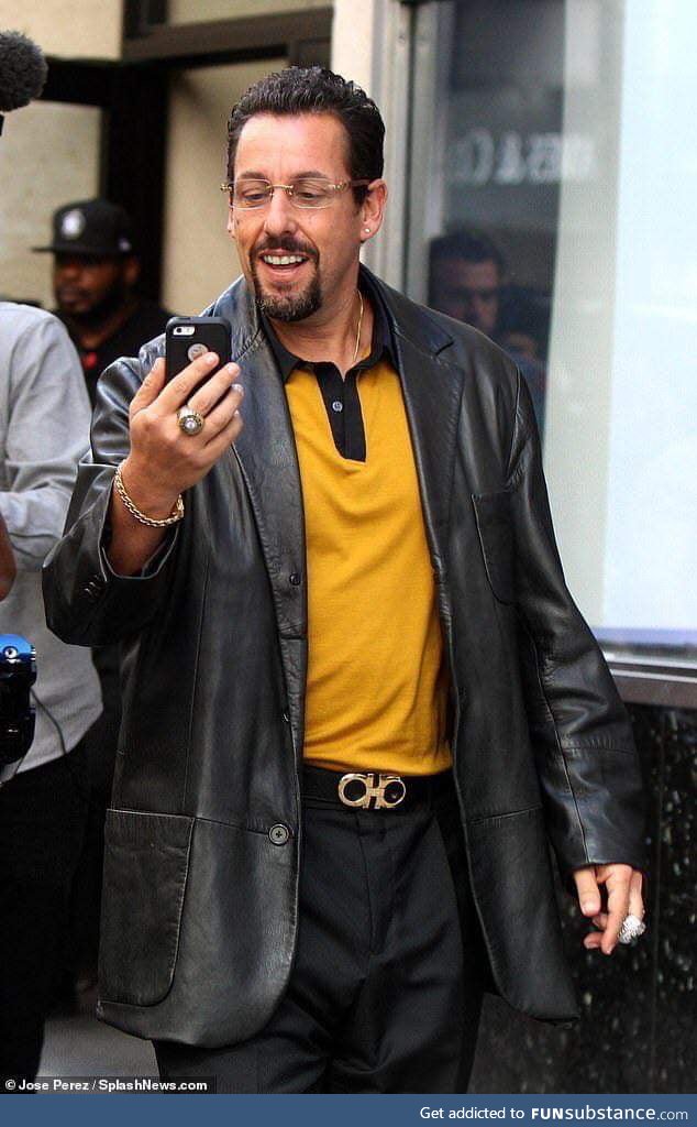 Adam Sandler looks like he owns about 4 strip clubs