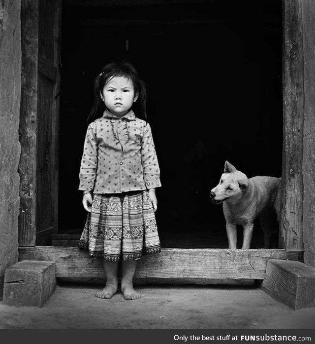 A girl and her dog. Somewhere in Vietnam, 2016