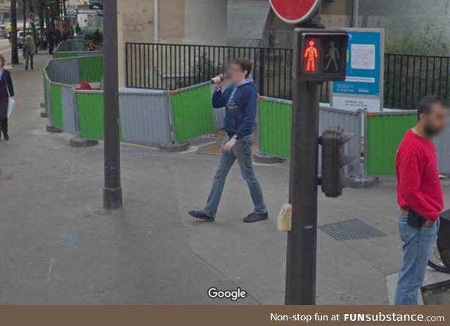 I've been immortalized drinking a beer while walking by a Google Street View Car