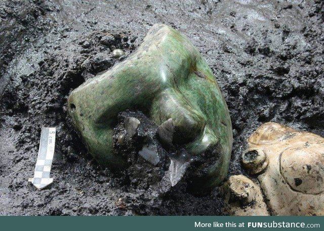 A 2000 years old green serpentine stone mask found at the base if an ancient pyramid in