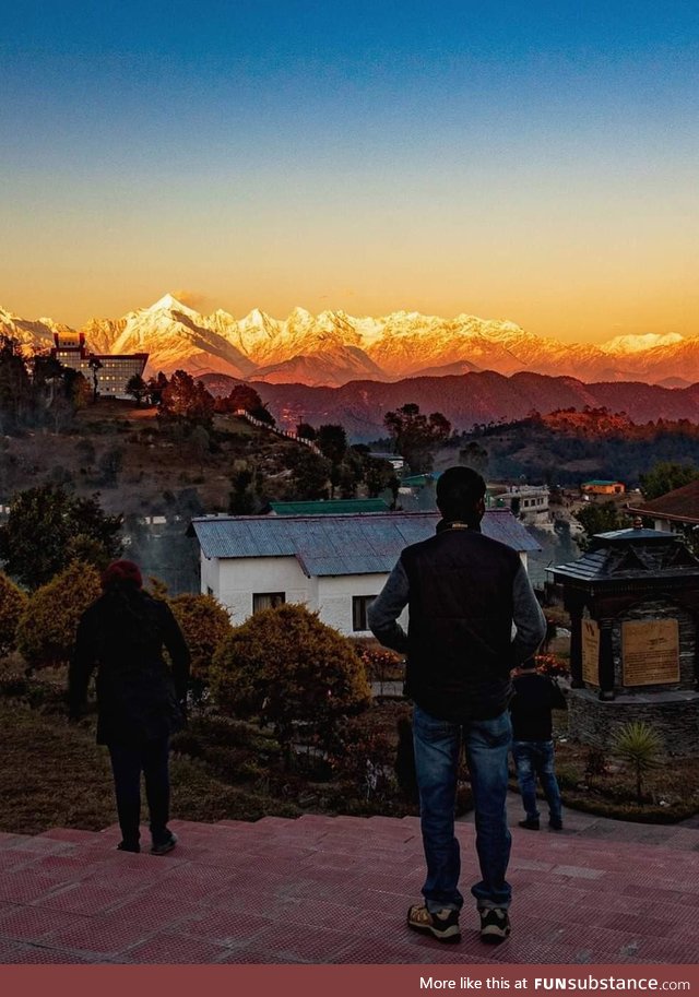 Golden Himalayan mountain range at sunrise
