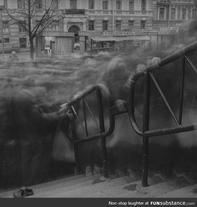 Long exposure of a crowd trying to enter Vasileostrovskaya subway station in Saint