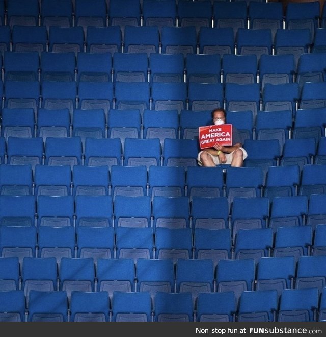 A single Trump supporter in a sea of empty blue seats in Tulsa today