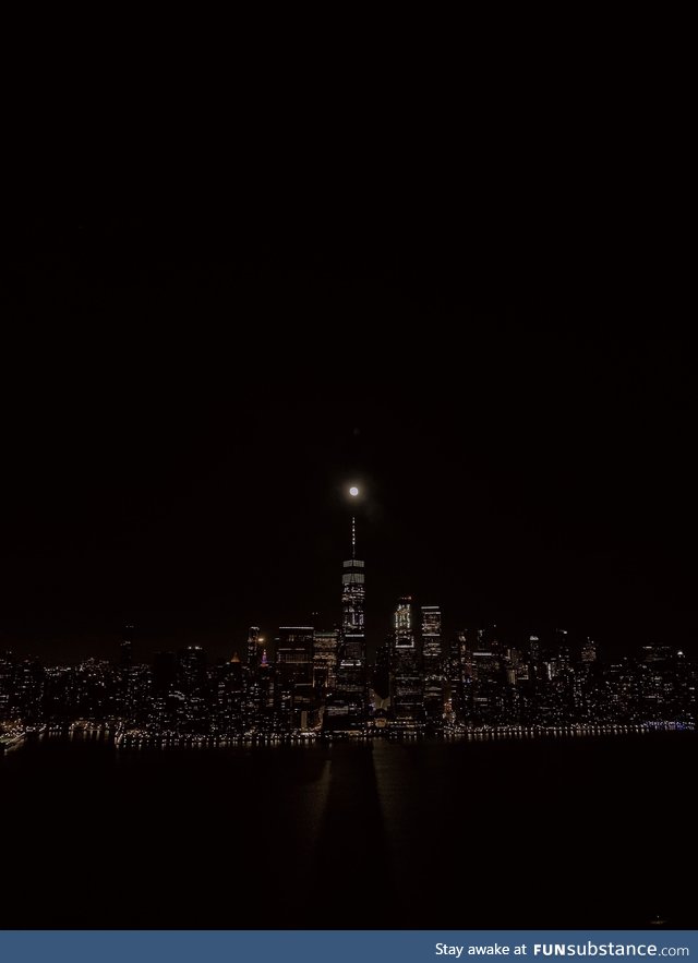The moon aligned with the World Trade Center and cast a shadow over the Hudson tonight