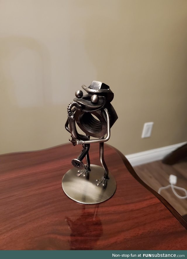 My husband's customer made him a little frog playing an instrument, using materials my