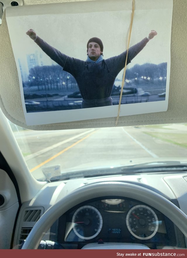 I keep this photo of Rocky in my car to remind myself I can do anything
