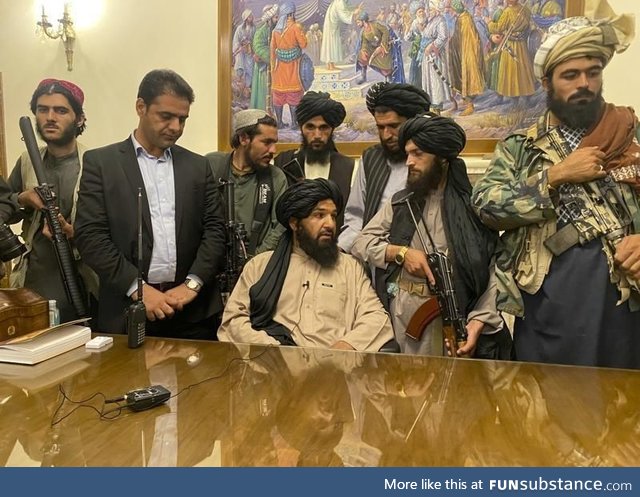 MAGA supporters gathered around Nancy Pelosi’s desk during the January 6th, 2015