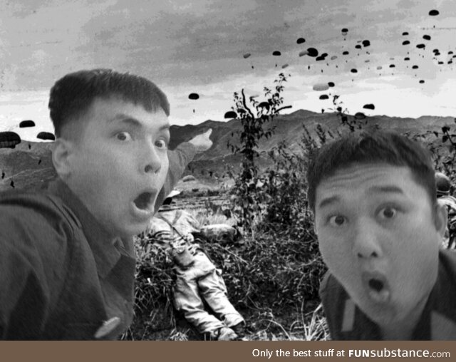 Two Viet Minh soldiers observe the french landing at Dien Bien Phu