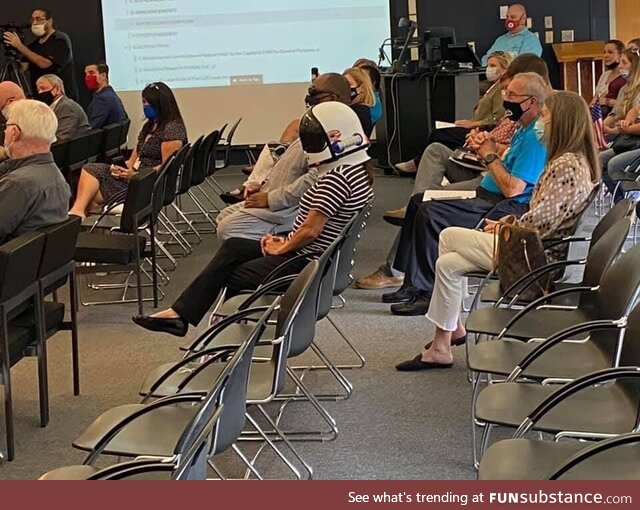 Woman at local anti-mask meeting wore a space helmet