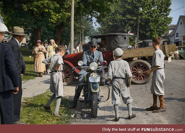 State cop's motorcycle admired by the local boys in Albany, Vermont, 1936. Colorized by