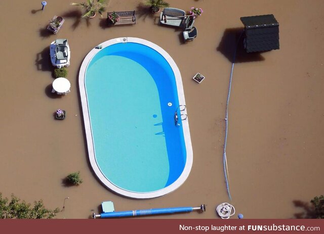 Swimming pool untouched by flood water