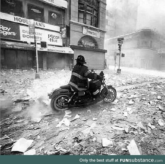 NY Fireman Tim Duffy rides into the city on his motorcycle on 9-11