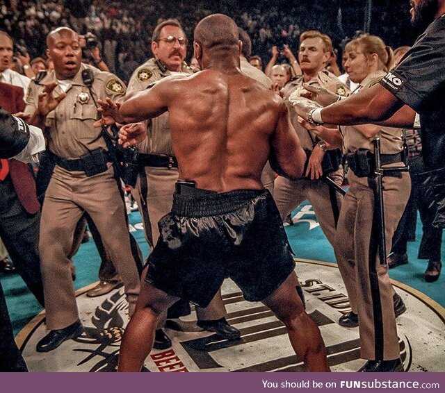 Las Vegas police trying to hold off Mike Tyson after he just bit off Evander