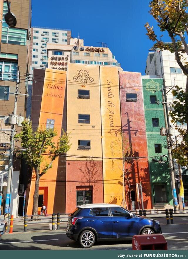 This book-shaped building in a street with lots of second-hand bookstores