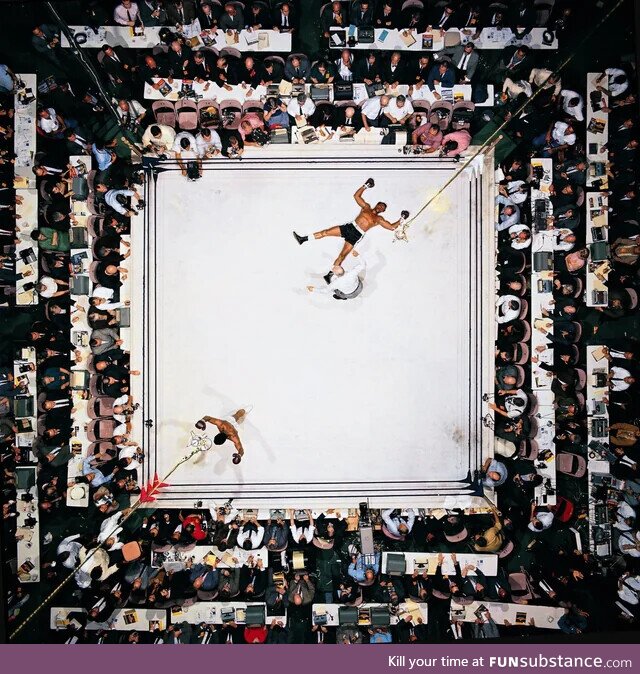 An overhead shot of Muhammad Ali celebrating a knockdown