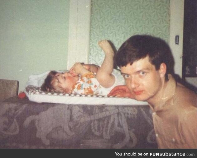 Ian Curtis, lead singer of Joy Division, with his infant daughter Natalie in 1980