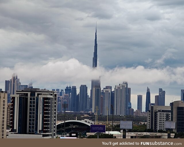 Burj Khalifa being bisected by clouds after dubai receives its worst rains in years