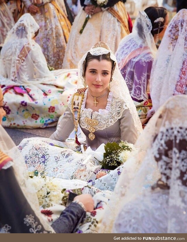 Women in the floral procession to the virgin of the helpless (Spain)