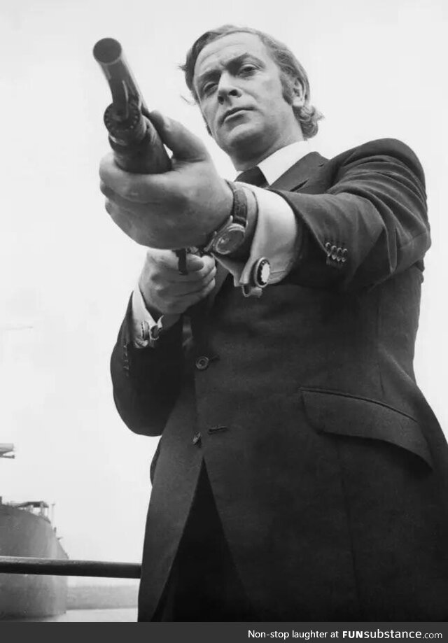 Michael Caine pointing Ithaca 37 (Promotional Photo for “Get Carter”)