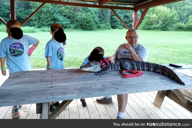 Our Cub Scouts met a man with an emotional support alligator named Wally
