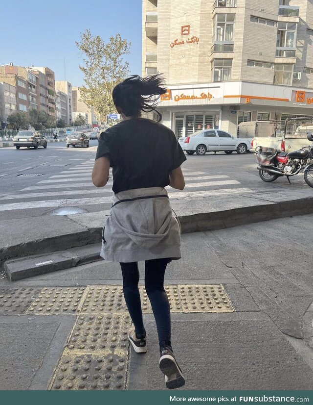 As a woman ,under the law of the IR she’s committing 2 crimes1 Showing her