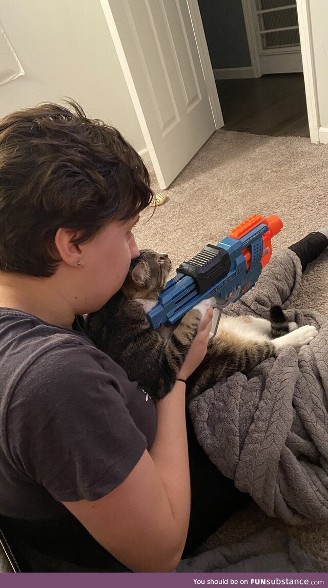 Gf teaching cat how to shoot