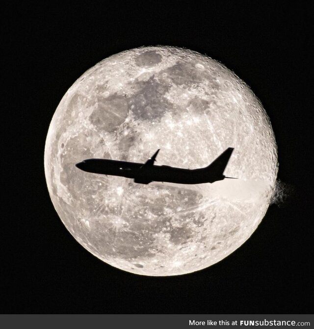 Jet flying by full moon. Orlando, Florida