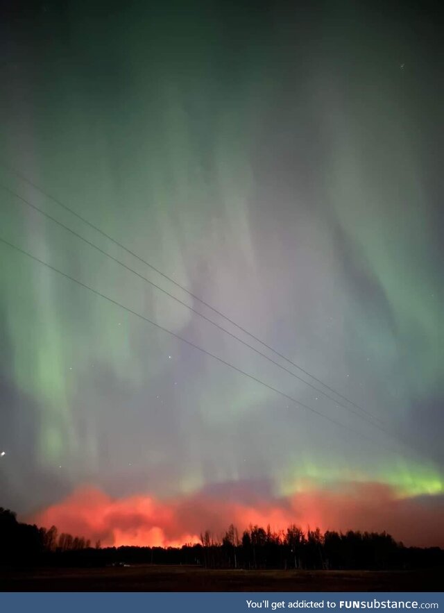 Wildfires in Alberta accompanied by Aurora Borealis