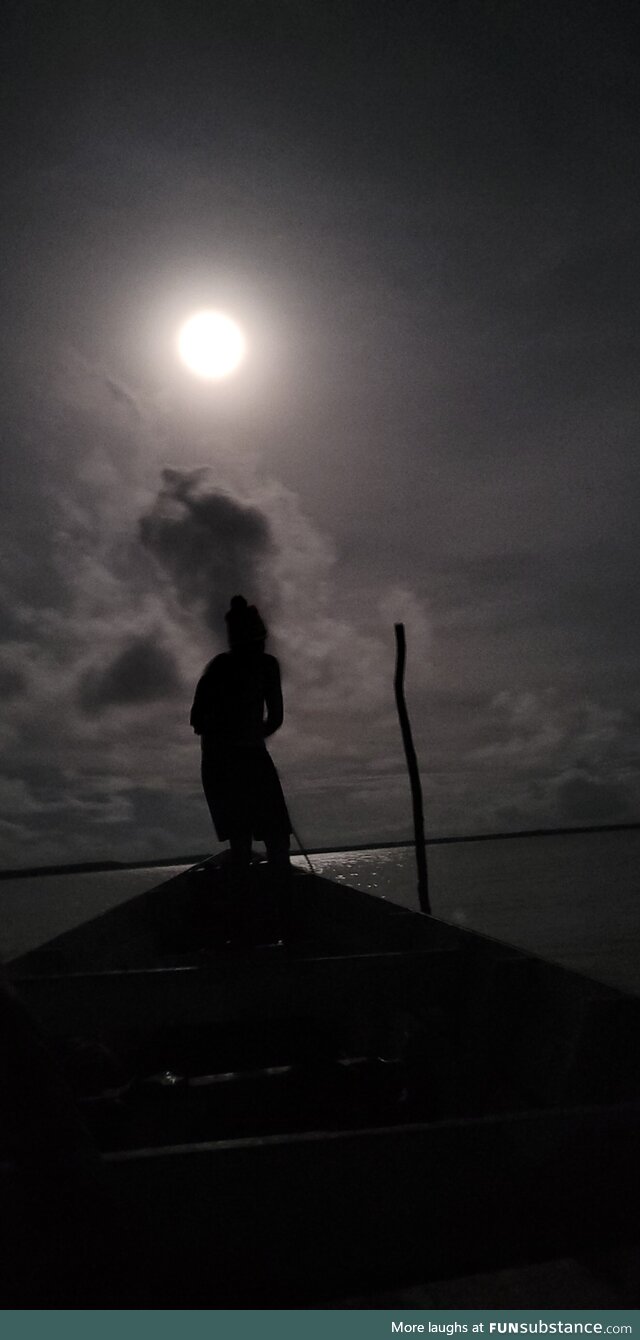 Local guide leading us on a wooden boat in the Atlantic Ocean to see leatherback turtles