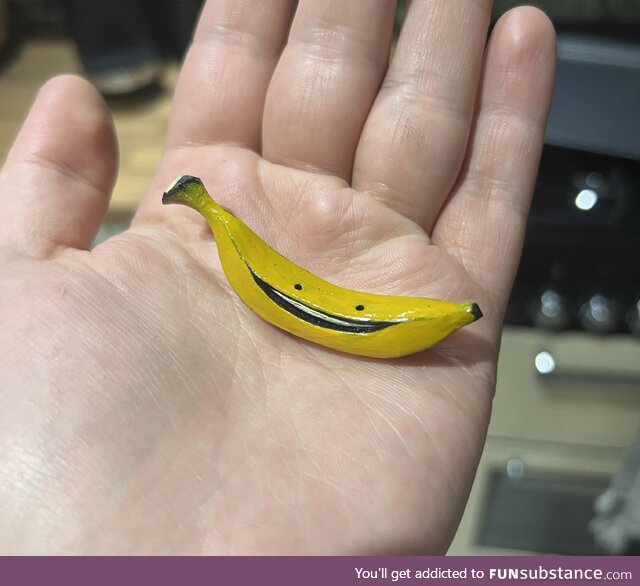 Tiny hand-carved banana character