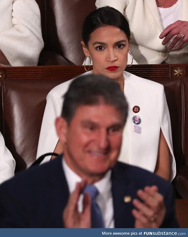 AOC looks at Senator Manchin