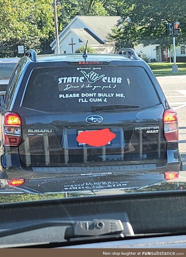 On a road between a church and elementary school