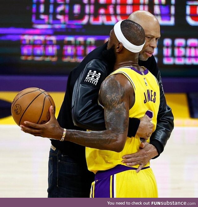 Former Lakers player Kareem Abdul-Jabbar congratulates LeBron James on a historic night